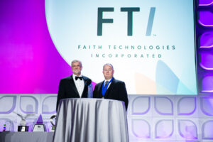 FTI accepts the ABC National Safety Merit Award. Pictured from left to right: Milton Graugnard, chair of the ABC board of directors; James Ramsey, FTI national safety director.