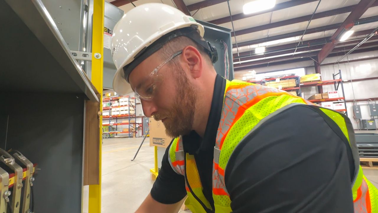 Excellerate team member working at manufacturing facility