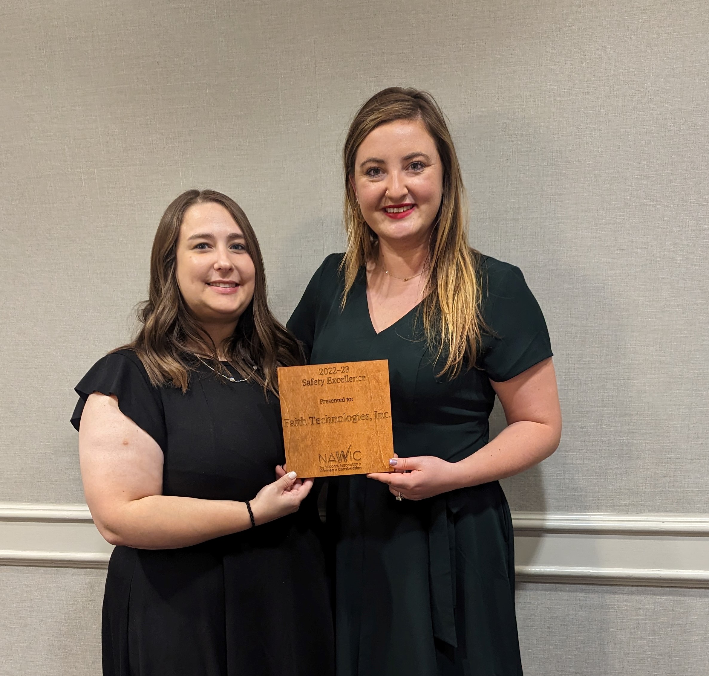 Sara Hutchcraft and Kelsey Harlow, Faith Technologies Incorporated team members, accept FTI’s first place 2022-2023 Safety Excellence Award from the National Association of Women in Construction. Sara is the immediate past president of the NAWIC Greater Kansas City Chapter #100.