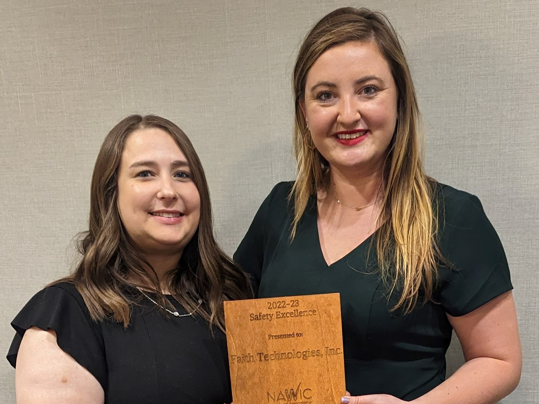 Sara Hutchcraft and Kelsey Harlow, Faith Technologies Incorporated team members, accept FTI’s first place 2022-2023 Safety Excellence Award from the National Association of Women in Construction. Sara is the immediate past president of the NAWIC Greater Kansas City Chapter #100.