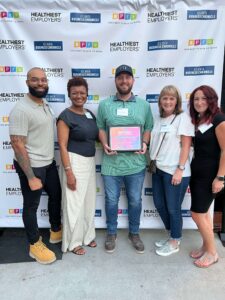 FTI team members accepted the Atlanta Healthiest Employer Award in August 2023.