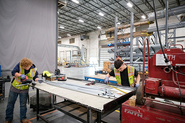 FTI team members working in a manufacturing facility