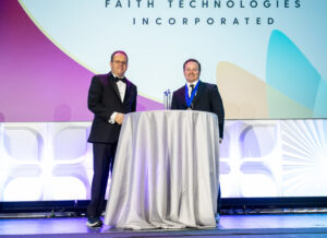 FTI accepts the ABC National Safety Merit Award. Pictured from left to right: Buddy Henley, chair of the ABC board of directors; Rocky Rowlett, FTI vice president of safety.