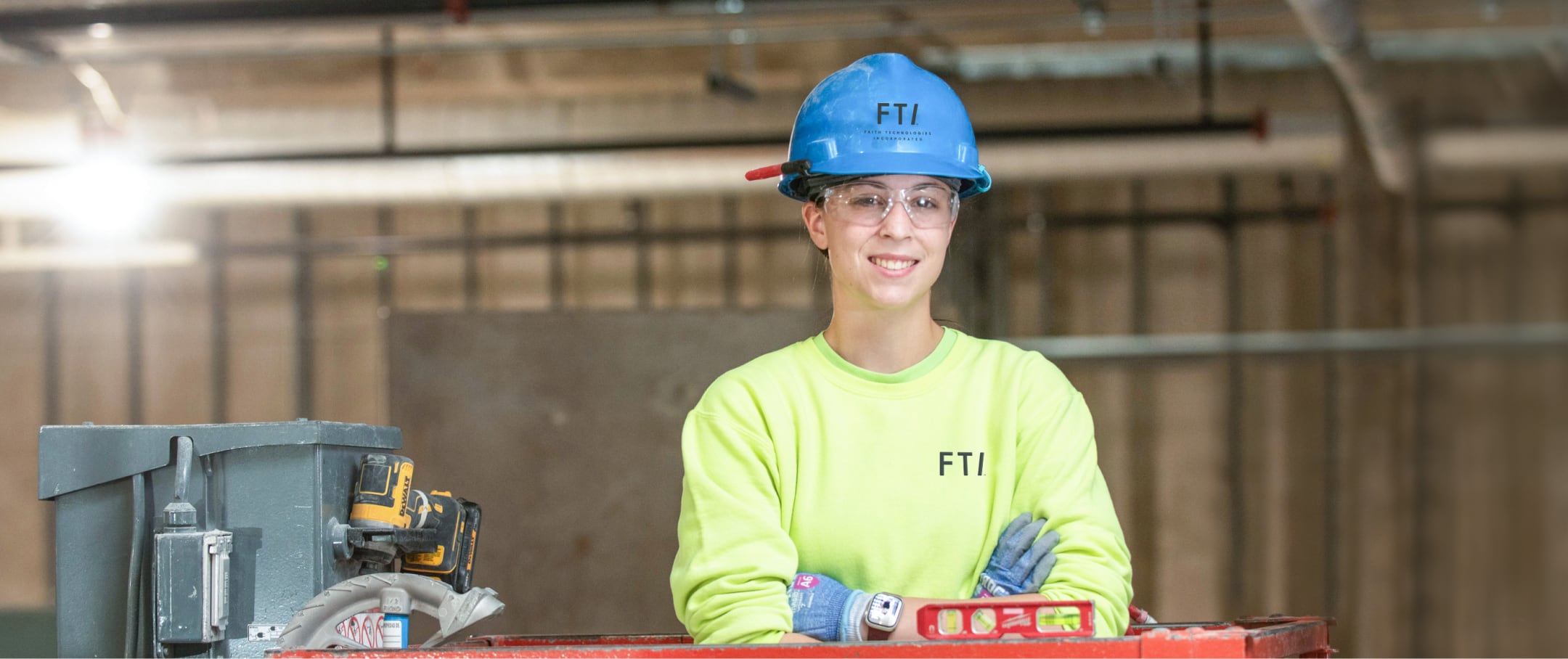 FTI team member wearing PPE and smiling on a job site