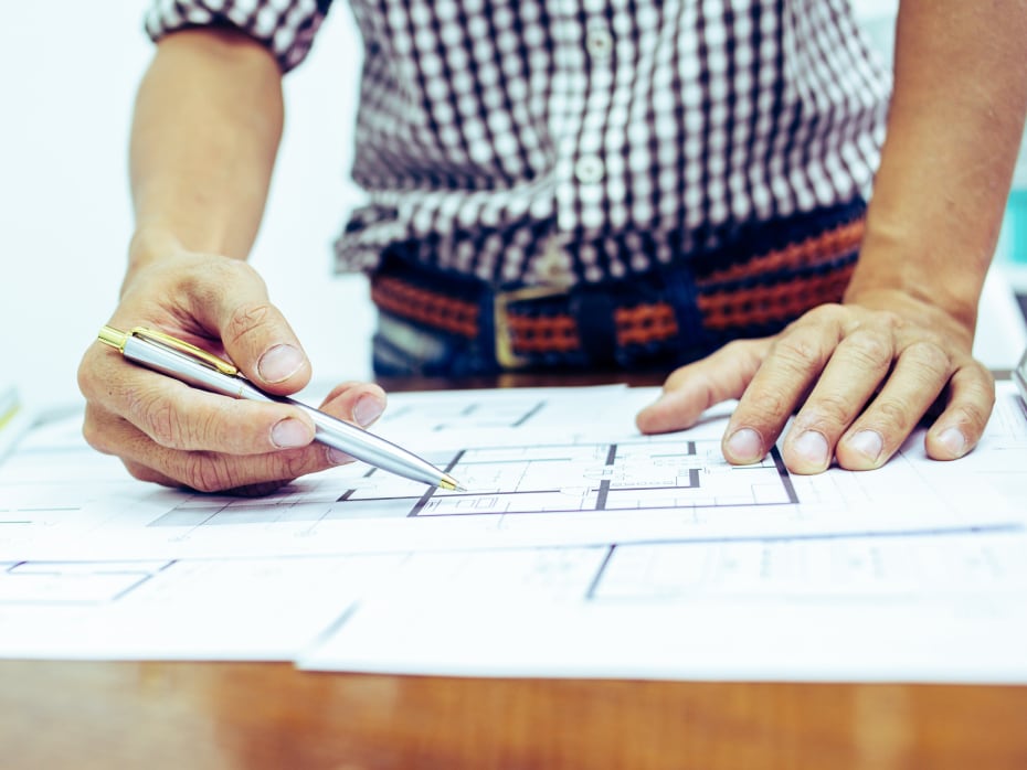 FTI team member reviewing plans