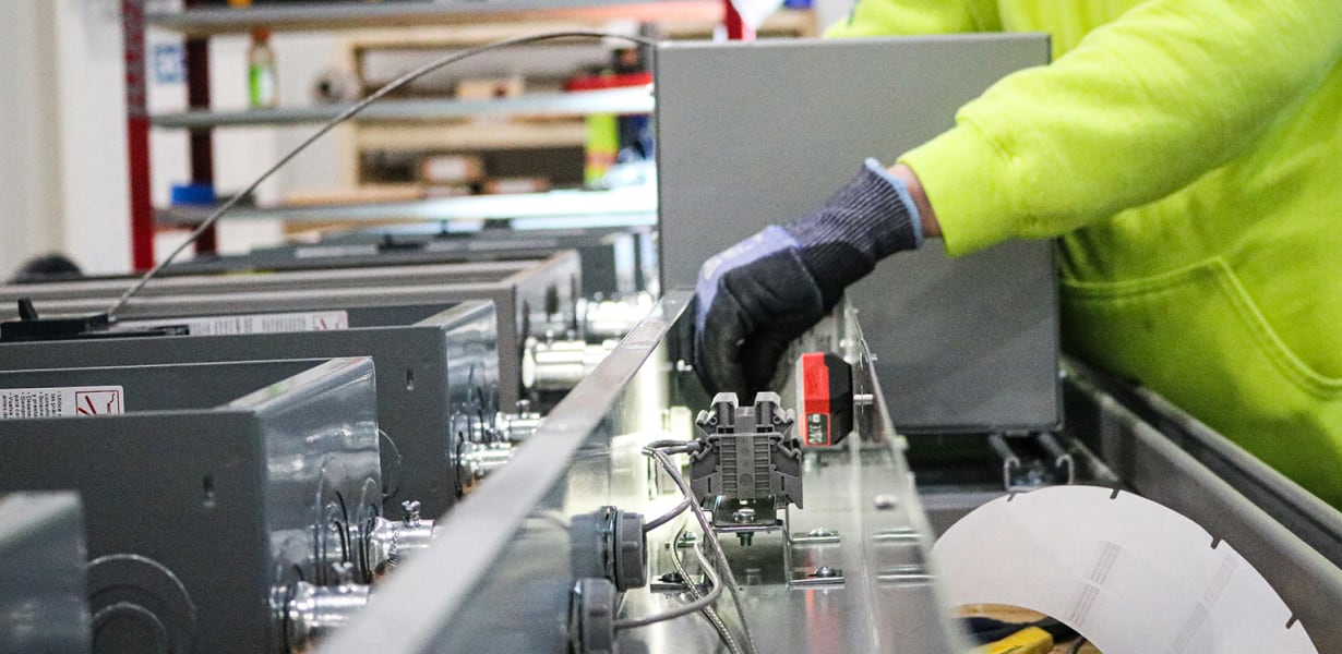 FTI Team Member working on electrical assembly