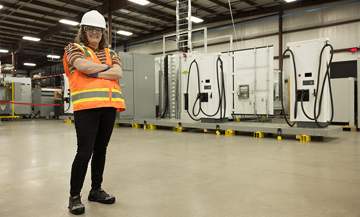 FTI Team Member in front of Excellerate Product